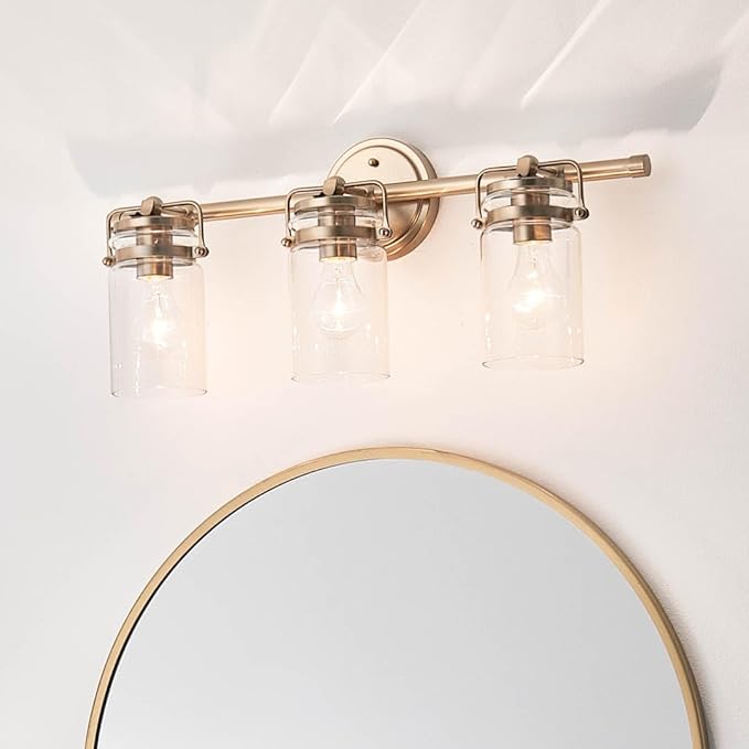 Kichler, Brinley 24" 3 Light Vanity Light with Clear Glass in Champagne Bronze for Bathroom and Powder Room, (24" W x 10.25" H), 45689CPZ