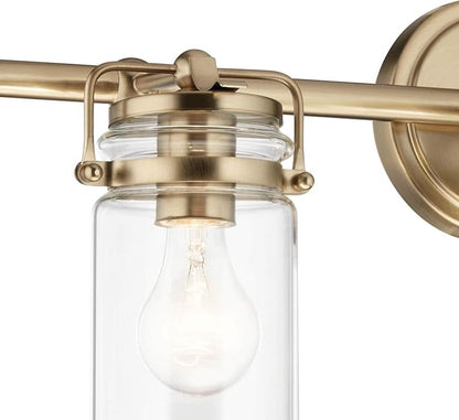 Kichler, Brinley 24" 3 Light Vanity Light with Clear Glass in Champagne Bronze for Bathroom and Powder Room, (24" W x 10.25" H), 45689CPZ