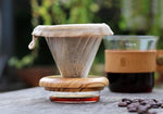 Load image into Gallery viewer, THIA Glass Pour Over Coffee Dripper Set, Glass Cone Dripper, Reusable Cloth Filter, Leather Cup Sleeve, Minimal Single Cup on the Go (Walnut Wood)
