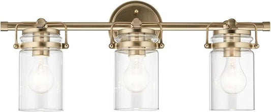 Kichler, Brinley 24" 3 Light Vanity Light with Clear Glass in Champagne Bronze for Bathroom and Powder Room, (24" W x 10.25" H), 45689CPZ