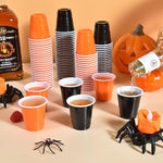 Load image into Gallery viewer, 100 Pack 2 oz Plastic Shot Glasses Disposable Shot Cups, Mini 2oz Party Cups for Halloween, Birthday, Wedding, Bachelorette Party, Baby Shower Supplies (Orange, Black)