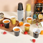 Load image into Gallery viewer, 100 Pack 2 oz Plastic Shot Glasses Disposable Shot Cups, Mini 2oz Party Cups for Graduation, Christmas, Birthday, Wedding, Bachelorette Party (Gold, Black)
