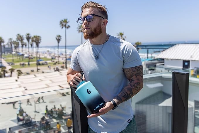 HYDRO CELL Stainless Steel Insulated Water Bottle with Straw - For Cold & Hot Drinks - Metal Vacuum Flask with Screw Cap and Modern Leakproof Sport Thermos for Adults (Teal/Black 64oz)