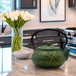 Load image into Gallery viewer, 900ml Small Cast Iron Tea Kettle, SECHUDO Teapot Coated with Enameled Interior for Stovetop, Japanese Green Tea Pot with Stainless Steel Strainer for Loose Leaf, Pine,Bamboo and Plum Pattern(30.4oz)