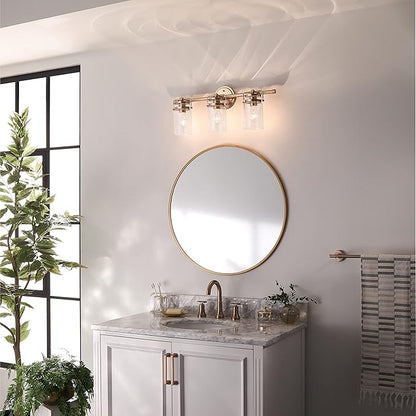 Kichler, Brinley 24" 3 Light Vanity Light with Clear Glass in Champagne Bronze for Bathroom and Powder Room, (24" W x 10.25" H), 45689CPZ